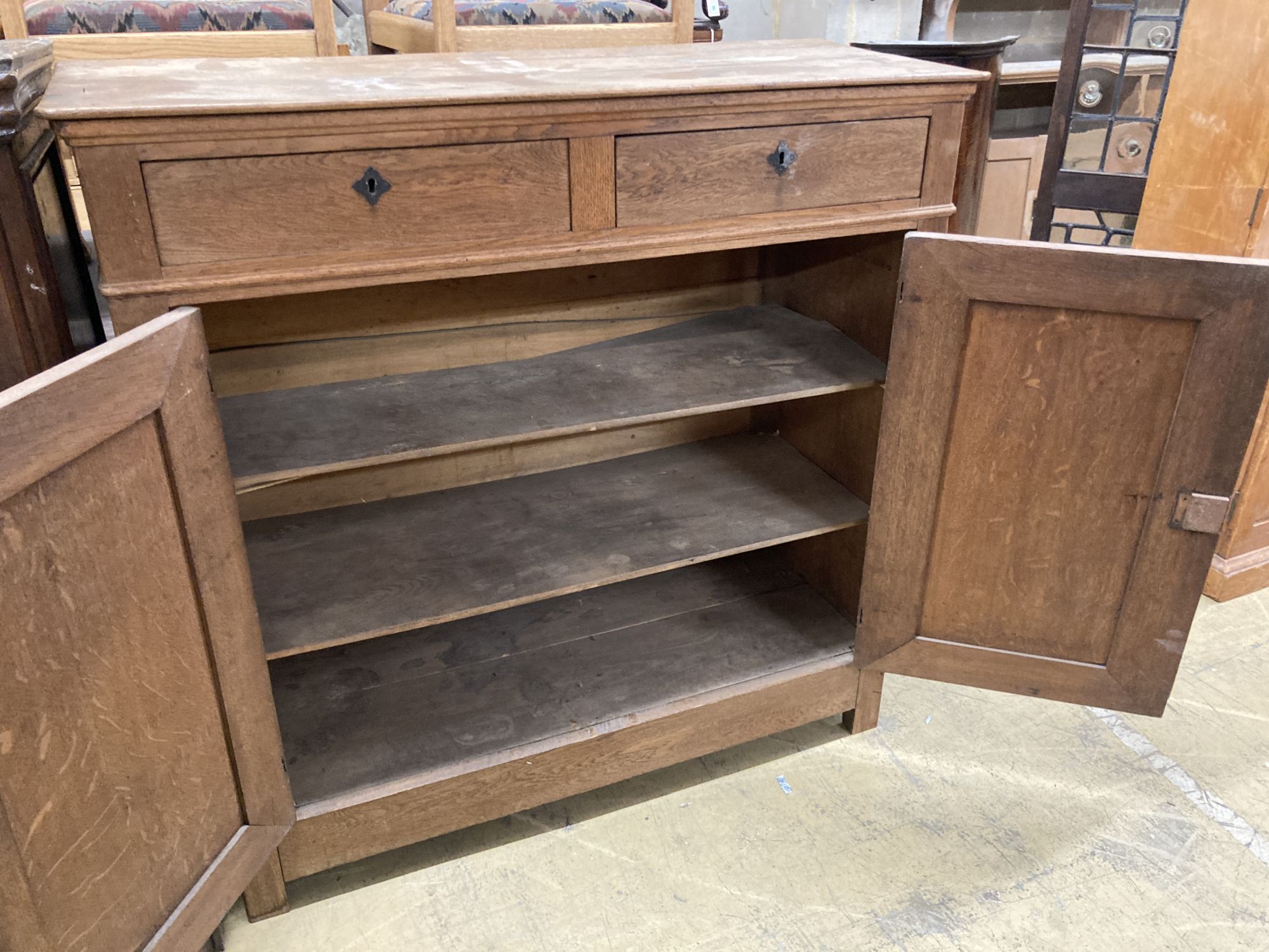 A 19th century Continental oak side cabinet